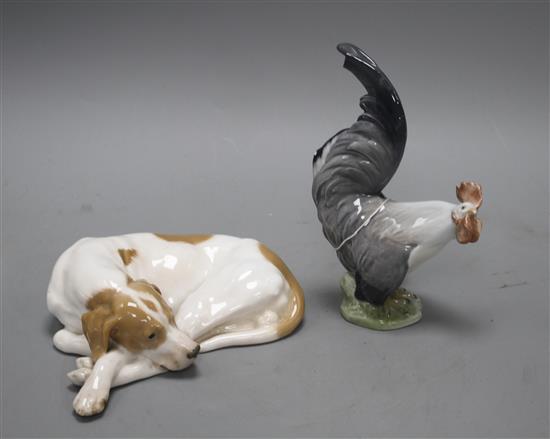 A Royal Copenhagen recumbent dog, model 1634 and a cockerel, model 1025, 20cm and 19.3cm